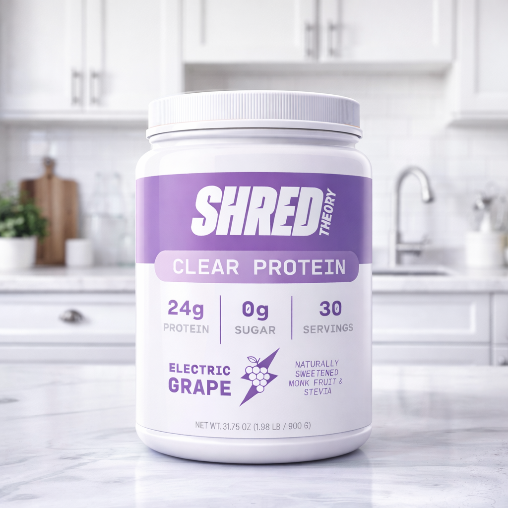 Tub of clear whey protein on table in a modern kitchen